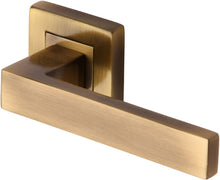 Load image into Gallery viewer, Heritage Brass Door Handle Lever Latch on Square Rose Delta Sq Design