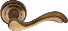 Load image into Gallery viewer, Heritage Brass Door Handle Lever Latch on Round Rose Lisboa Design